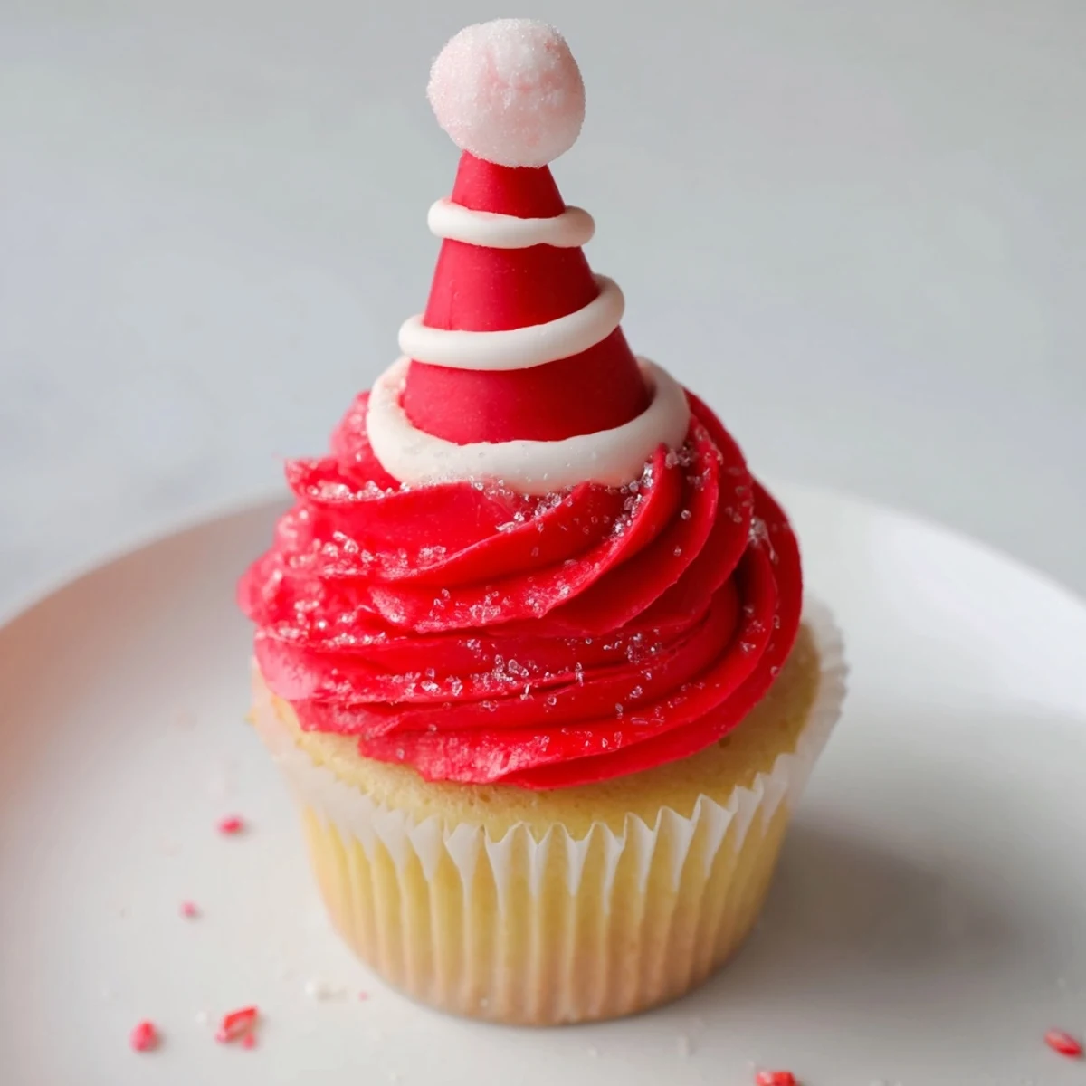 Vivid image: A towering Elf Hat Cupcake arrangement, perfect for holiday gatherings, ready to eat.