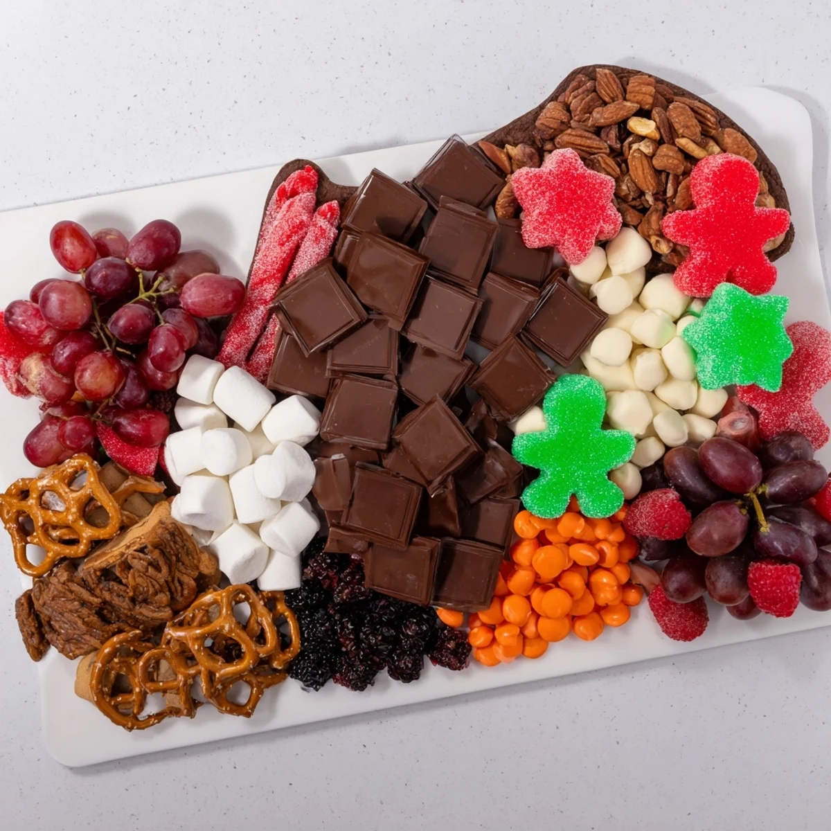 A colorful Cozy Mitten Dessert Board, inviting treats arranged like a mitten, ideal for a cozy dessert spread.