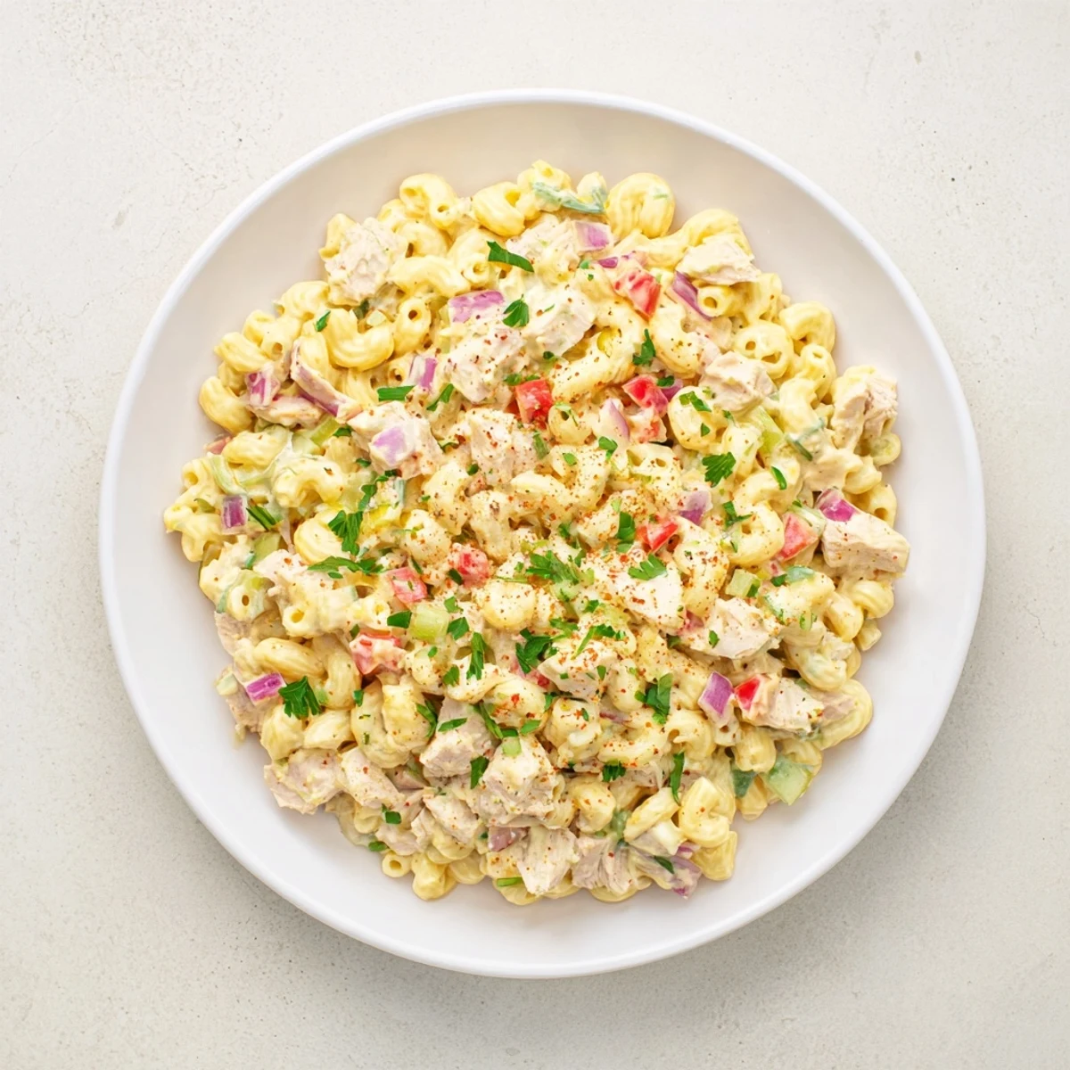 Chicken Macaroni Holiday Salad, a creamy, cold Southern classic, with colorful veggies and chicken pieces.