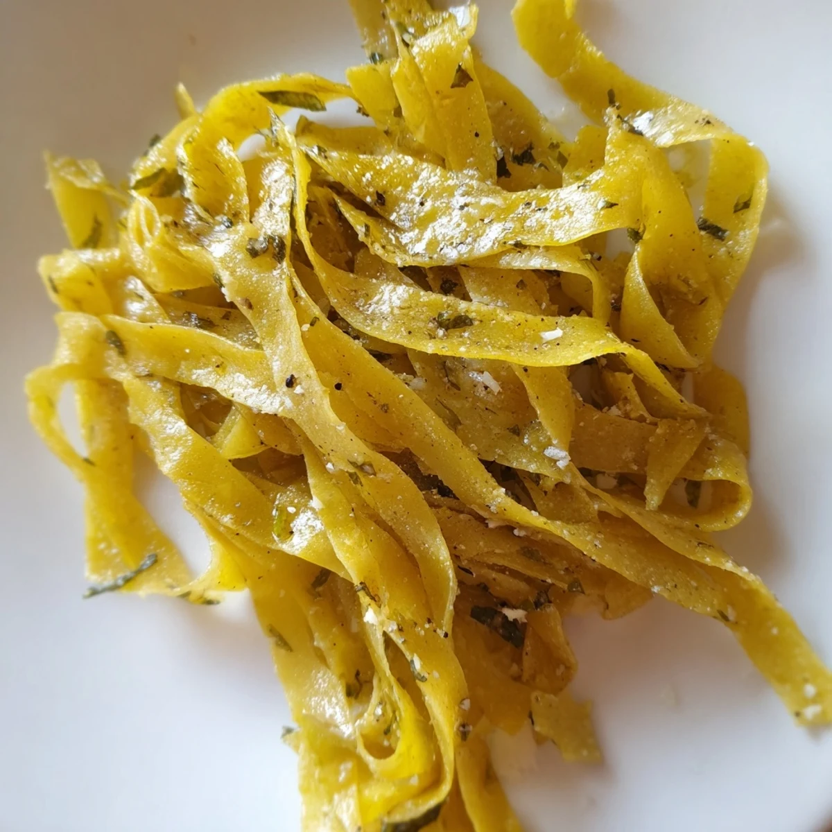 Freshly made, golden garlic lumpia chips ready to serve with a flavorful dipping sauce.