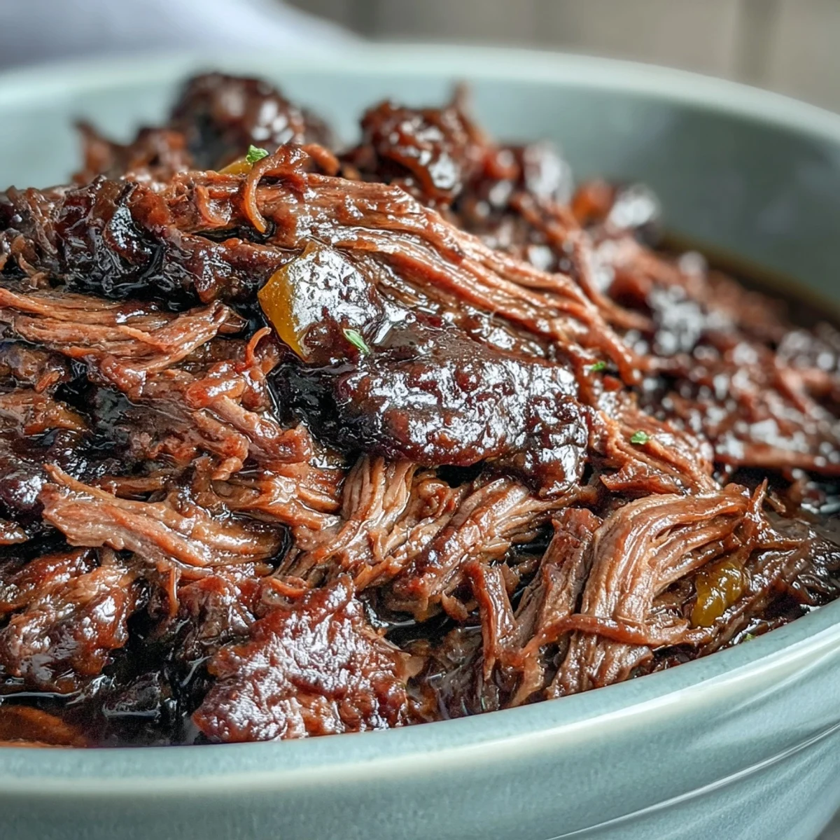 Slow-cooked Slow Cooker Mississippi-Style Ranch Beef shredded and piled onto a toasted hoagie bun with melted provolone.