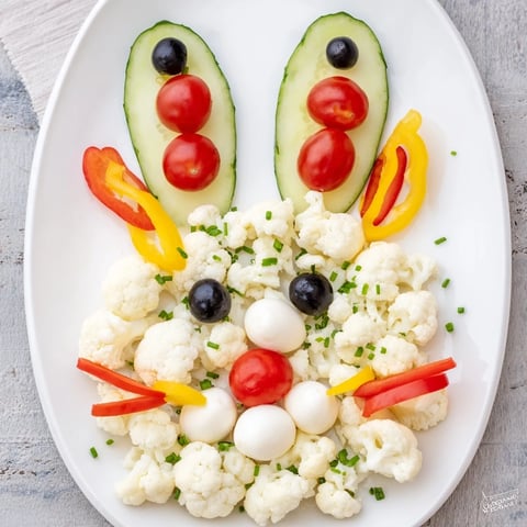 Easter Bunny Spring Platter brimming with colorful veggies, dips, and crackers for a festive gathering.