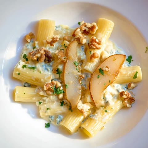 Close up shows rich Rococo Pasta with a sprinkle of walnuts, offering a delightful texture.