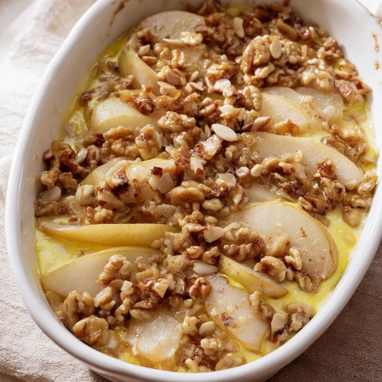 A close-up of quick chestnut & pear gratin, showing the caramelized top and tender fruit filling.