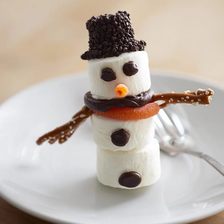 Kids will love this festive Marshmallow Snowman Stick Arrangement, a fun and delicious no-bake dessert option.